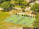 Overhead view of a large green basketball court complex surrounded by trees and shrubbery at 1121 Arbor Glen Cir, Winter Springs, FL 32708