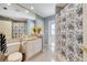 Hallway view of a bathroom featuring a vanity, toilet, shower, and stylish decor at 1121 Arbor Glen Cir, Winter Springs, FL 32708
