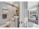 Bathroom with a glass vessel sink, granite counters, and adjacent office space at 1121 Arbor Glen Cir, Winter Springs, FL 32708