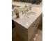 Bathroom vanity featuring a sink with silver fixtures and decorative vases at 1121 Arbor Glen Cir, Winter Springs, FL 32708