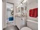 Bathroom with a glass vessel sink, granite counters, unique wallpaper, and view of the main bedroom at 1121 Arbor Glen Cir, Winter Springs, FL 32708