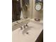 Well-lit bathroom vanity with a decorative mirror and silver fixtures at 1121 Arbor Glen Cir, Winter Springs, FL 32708