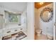 Bathroom featuring a jacuzzi tub, adjacent toilet with bidet, and skylight providing natural light at 1121 Arbor Glen Cir, Winter Springs, FL 32708