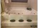 Step-up soaking tub with silver fixtures and recessed decor at 1121 Arbor Glen Cir, Winter Springs, FL 32708