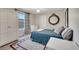 Comfortable bedroom features a window with a view, dresser, wardrobe, and decorative mirror at 1121 Arbor Glen Cir, Winter Springs, FL 32708