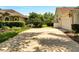 Long driveway to home with mature landscaping featuring green lawn and decorative bushes with tree providing shade at 1121 Arbor Glen Cir, Winter Springs, FL 32708