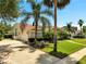 Charming one-story home with a well-manicured lawn, palm trees and lush landscaping with a two car garage at 1121 Arbor Glen Cir, Winter Springs, FL 32708