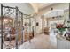 Elegant foyer featuring tile floors, decorative columns, arched doorways, and views into the living and dining rooms at 1121 Arbor Glen Cir, Winter Springs, FL 32708