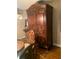 Close up of an ornate wooden hutch with carved details in the dining area at 1121 Arbor Glen Cir, Winter Springs, FL 32708