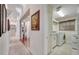 Hallway view of the main level and a laundry room featuring a washer and dryer at 1121 Arbor Glen Cir, Winter Springs, FL 32708