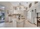 Bright, high-ceilinged kitchen with white cabinets, granite counters, and a center island at 1121 Arbor Glen Cir, Winter Springs, FL 32708