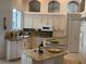Bright kitchen with granite countertops, white cabinetry, and modern appliances at 1121 Arbor Glen Cir, Winter Springs, FL 32708