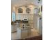 Bright kitchen with granite countertops, white cabinetry, and modern appliances at 1121 Arbor Glen Cir, Winter Springs, FL 32708