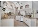 Spacious kitchen featuring granite countertops, white cabinets, tile floors, and modern appliances at 1121 Arbor Glen Cir, Winter Springs, FL 32708