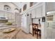 Kitchen area featuring a work desk and counter space, with appliances and access to a laundry room at 1121 Arbor Glen Cir, Winter Springs, FL 32708