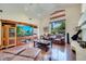 Spacious living room with a high ceiling, a large window, and a built-in entertainment center at 1121 Arbor Glen Cir, Winter Springs, FL 32708