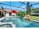 Stunning screened-in pool area with rock waterfall and spa, perfect for relaxing and entertaining outdoors at 1121 Arbor Glen Cir, Winter Springs, FL 32708