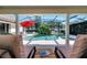 Inviting pool area with waterfall feature and poolside seating, offering a serene outdoor living experience at 1121 Arbor Glen Cir, Winter Springs, FL 32708