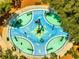 Overhead view of splash pad with colorful blue and green surface and yellow fish design at 1121 Arbor Glen Cir, Winter Springs, FL 32708