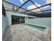 A perfect pool and patio view ideal for relaxation and backyard entertaining at 1264 Blue Island Dr, Clermont, FL 34714