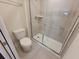 Modern bathroom featuring a toilet and walk-in shower with glass door at 1286 Shoreside St, Clermont, FL 34714