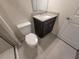 Clean bathroom featuring a toilet, granite vanity top, and walk-in shower with tiled walls at 1286 Shoreside St, Clermont, FL 34714