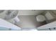 Small bathroom with pedestal sink, toilet, and tiled floor at 1286 Shoreside St, Clermont, FL 34714