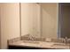 Bathroom featuring double sinks with granite countertops and large mirrors at 1286 Shoreside St, Clermont, FL 34714