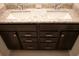 Bathroom vanity with granite countertops and dark cabinets at 1286 Shoreside St, Clermont, FL 34714