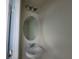 Small bathroom with white pedestal sink, oval mirror, and simple light fixture at 1286 Shoreside St, Clermont, FL 34714