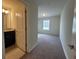 Comfortable bedroom showcasing neutral carpet, closet and natural light from a window at 1286 Shoreside St, Clermont, FL 34714