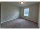 Cozy bedroom featuring neutral carpet, a closet, and natural light from a window at 1286 Shoreside St, Clermont, FL 34714