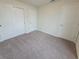Bright and airy bedroom featuring neutral walls, carpet and closet at 1286 Shoreside St, Clermont, FL 34714