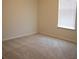 Bright bedroom features neutral walls, carpet, and a window with blinds at 1286 Shoreside St, Clermont, FL 34714
