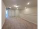 Large bonus room with neutral carpet, light walls, and recessed lighting at 1286 Shoreside St, Clermont, FL 34714