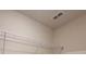 Walk-in closet featuring built-in metal shelving at 1286 Shoreside St, Clermont, FL 34714