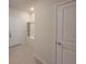 Entryway featuring tile floors, built-in shelving and coat closet at 1286 Shoreside St, Clermont, FL 34714
