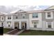 Charming two-story townhomes feature craftsman-style details and a landscaped front yard at 1286 Shoreside St, Clermont, FL 34714