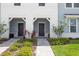 Charming townhouse exterior with well-maintained landscaping and inviting front entrance at 1286 Shoreside St, Clermont, FL 34714