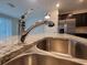 Close-up of the kitchen sink, granite counters, and stainless appliances at 1286 Shoreside St, Clermont, FL 34714