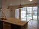 Kitchen with a granite island and view to the backyard pool at 1286 Shoreside St, Clermont, FL 34714