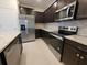 Modern kitchen with stainless steel appliances and granite countertops at 1286 Shoreside St, Clermont, FL 34714