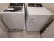 Modern laundry room featuring a new white Whirlpool washer and dryer at 1286 Shoreside St, Clermont, FL 34714