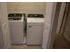 Laundry room with a modern white Whirlpool washer and dryer at 1286 Shoreside St, Clermont, FL 34714