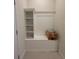 Mudroom featuring built-in bench with storage and shelving at 1286 Shoreside St, Clermont, FL 34714