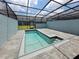 This in-ground pool is surrounded by an enclosure and provides a refreshing backyard oasis for fun at 1286 Shoreside St, Clermont, FL 34714
