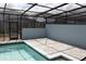 View of a screened-in pool area with tile accents and paved patio for entertaining at 1286 Shoreside St, Clermont, FL 34714