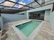 Poolside view showcases the pool, paved patio, and screened enclosure at 1286 Shoreside St, Clermont, FL 34714