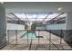 Screened-in backyard featuring a refreshing swimming pool and a protective safety fence at 1286 Shoreside St, Clermont, FL 34714
