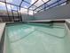 Screened-in pool with clear water and tile accents offers a refreshing outdoor experience at 1286 Shoreside St, Clermont, FL 34714